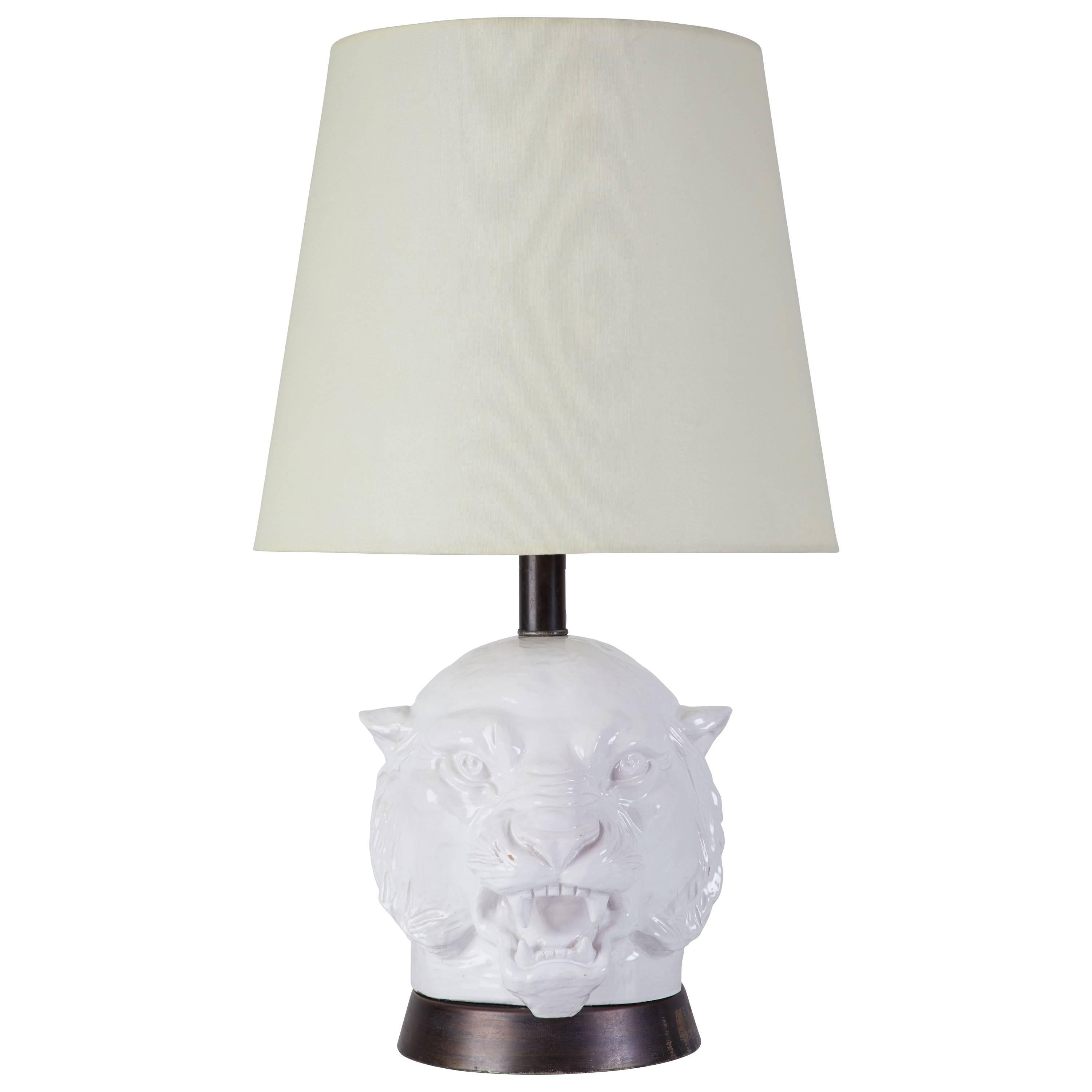Ceramic slip cast tiger head table lamp with custom silk shade and metal base. Designed in the Italy, circa 1960s. Marked Italy to base. Rewired with French twist silk cord, original on/off switch. Takes one 100w maximum E26 light bulb. Height of