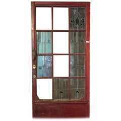 An Arts & Crafts Stained Glass Door with Stylized Floral Details Original Handle