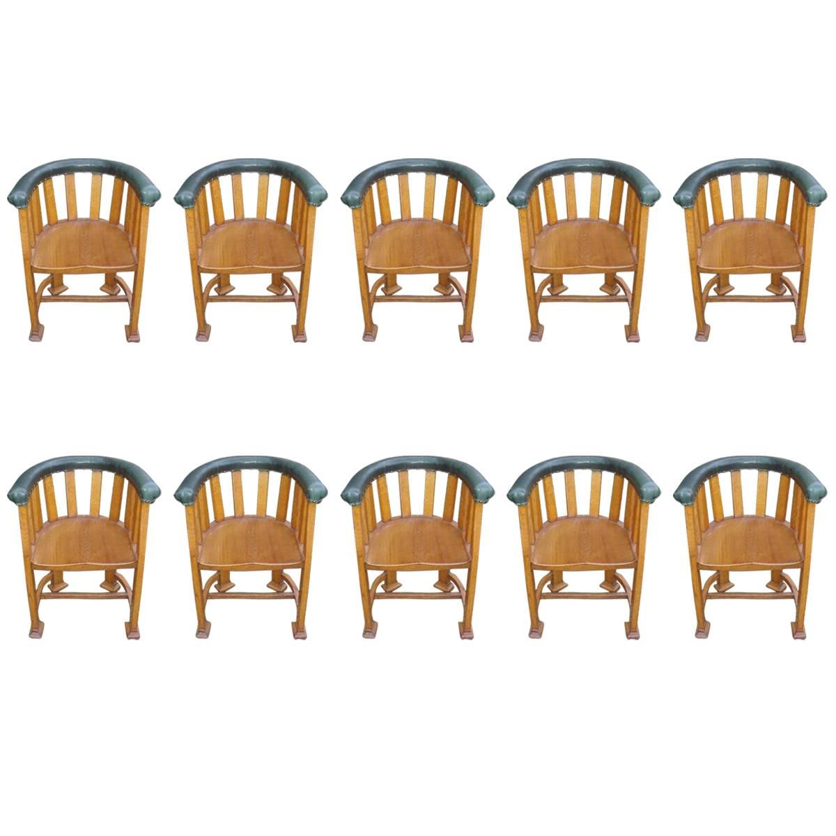 Waring and Gillows, Ten Arts and Crafts Oak Tub Chairs with Shaped Solid Seats