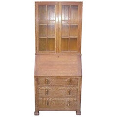 Antique Heals. A Limed Oak Bureau Bookcase of Slim Proportions on Sledge Style Feet.