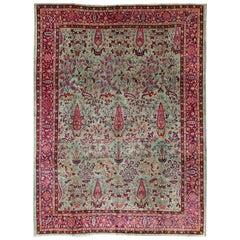 Tapis Agra ancien à motifs floraux ramifiés en vert menthe, violet et bourgogne