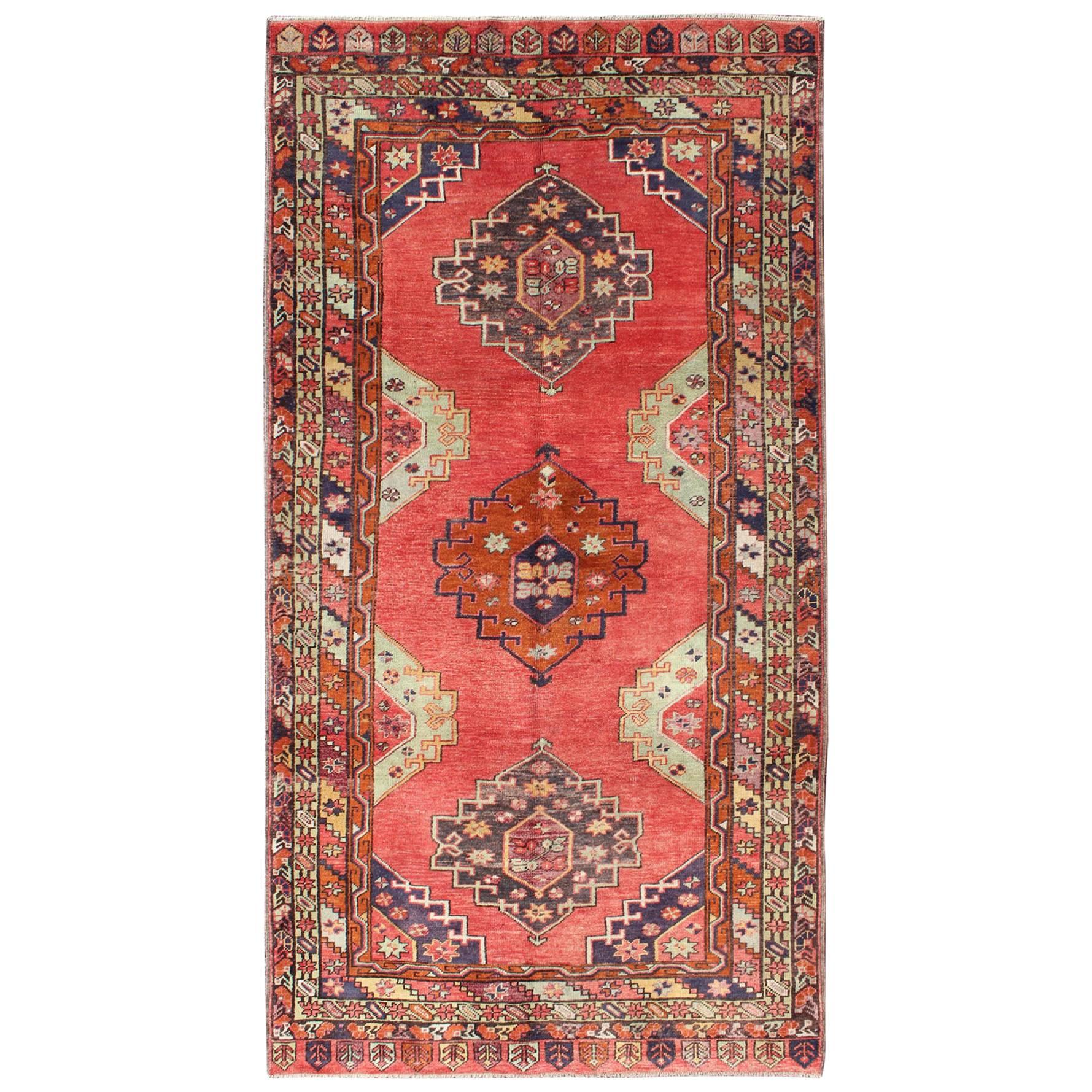 Red Field Vintage Turkish Oushak Rug with Vertical Geometric Medallions For Sale