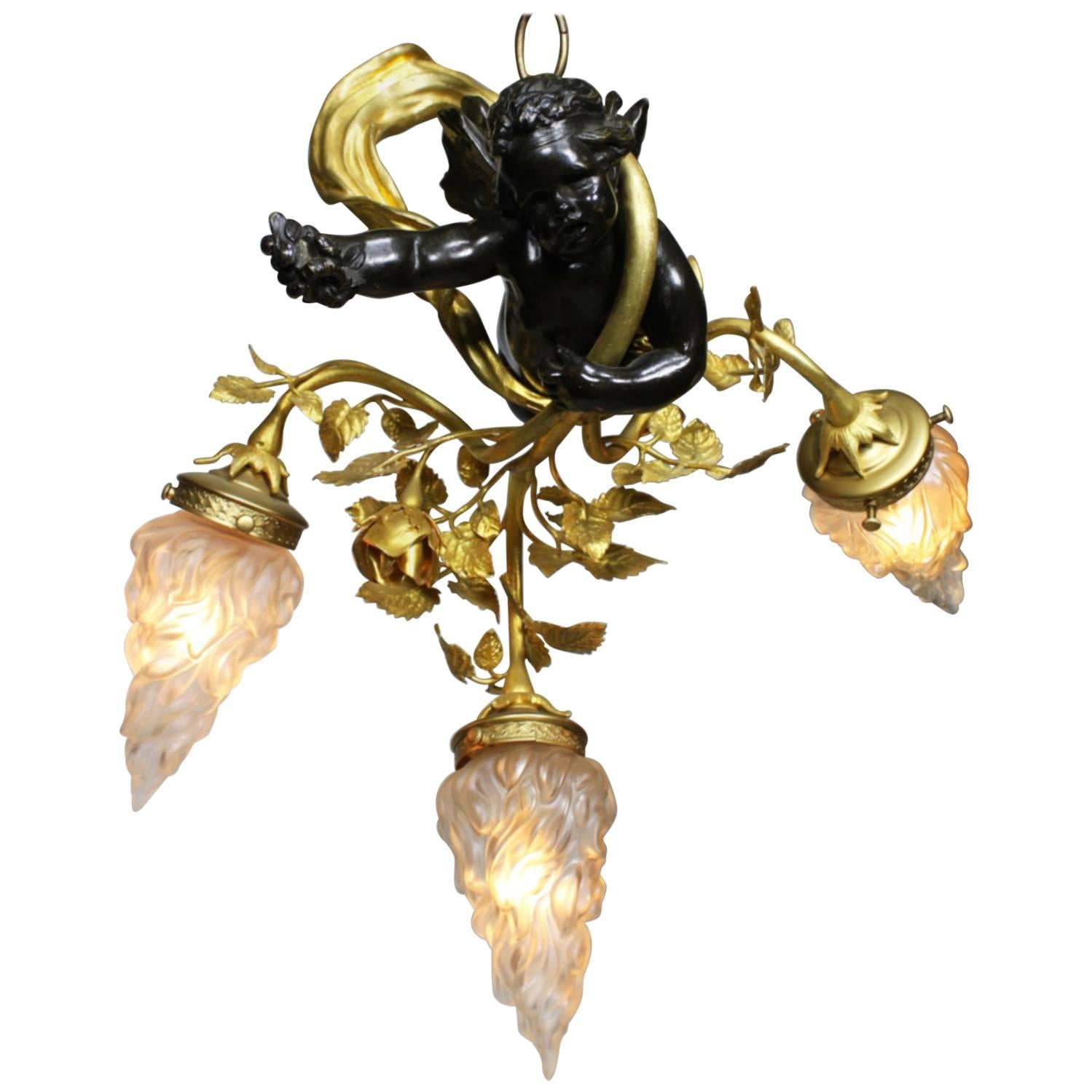 French Belle Époque Patinated and Gilt Bronze & Metal Hovering Cherub Chandelier For Sale