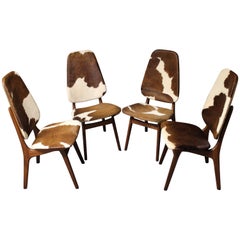 Four Arne Hovmand Olsen Danish Teak Dining Chairs with Cowhide Upholstery