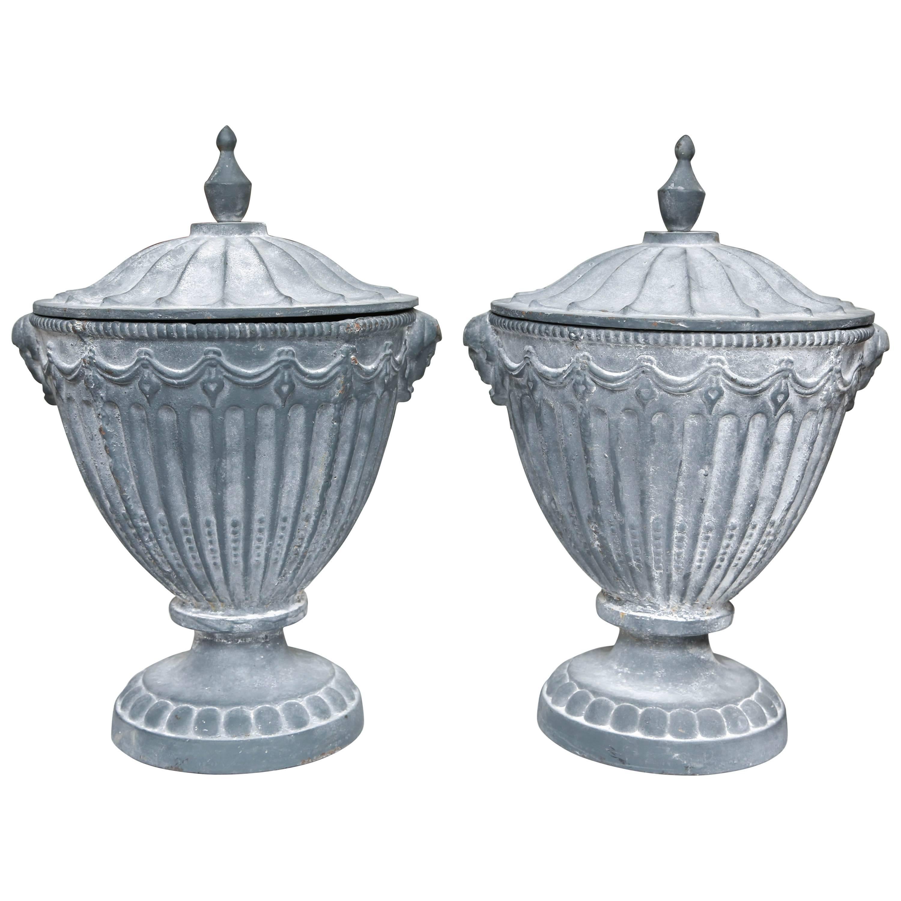 Pair of Covered Neoclassic Iron Garden Urns
