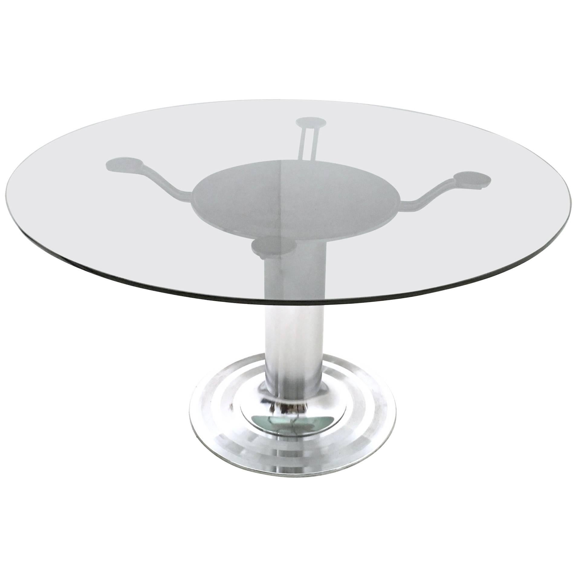 Made in Italy, 1970s.
It features a chrome-plated metal pedestal and a round tempered glass top. 
This 8- seat table is vintage, therefore it might show slight traces of use, but it is in such an excellent original condition, that it is ready to