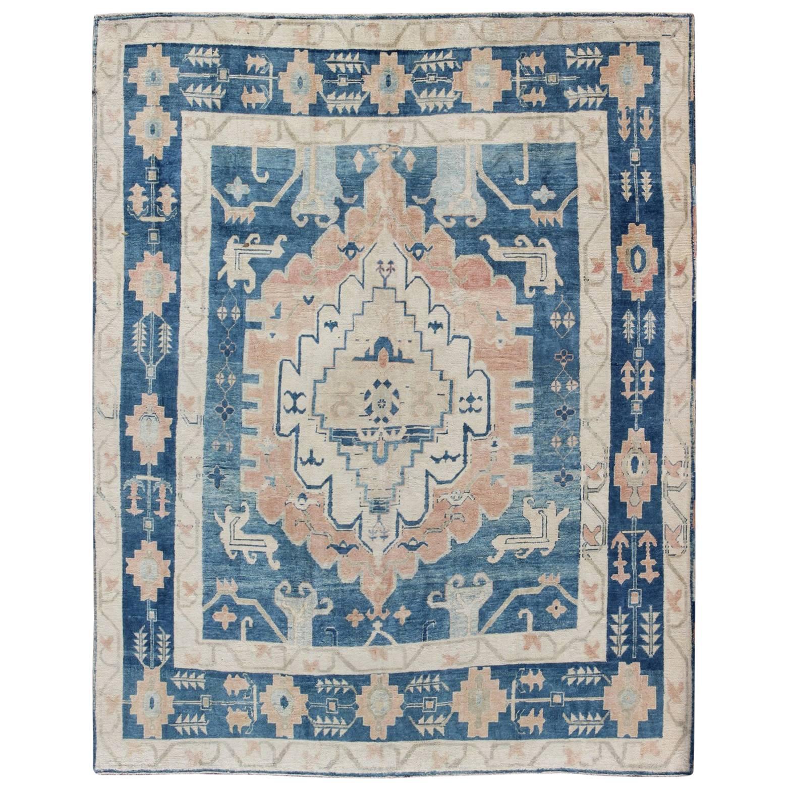 Blue and Salmon Vintage Turkish Oushak Rug with Layered Medallion and Motifs  For Sale
