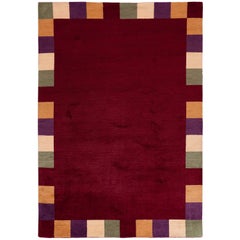 Alfombra roja con borde a cuadros