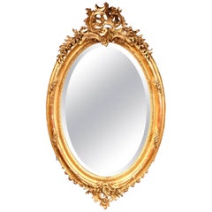 19th Century French Louis XV Carved Gold Leaf Oval Mirror with Bevelled Glass
