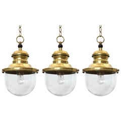 Brass and Glass Globe Pendant Lights, France, circa 1950s