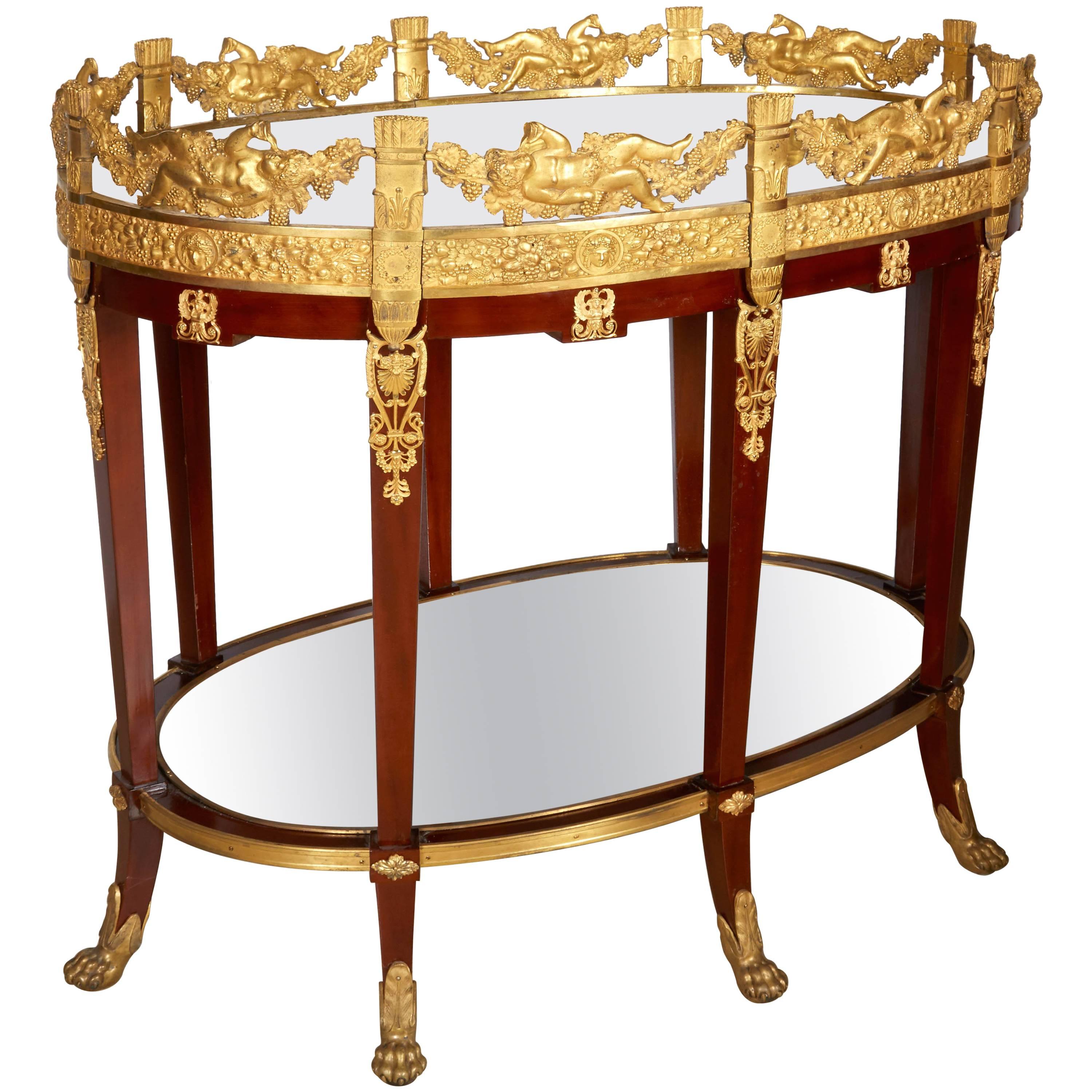 An exquisite French ormolu bronze and mahogany surtout de table plateau / bar cart

Attributed to Pierre Philippe Thomire, circa 1860. 

Exceptional quality, one of the best and finest plateau's we have come across. All original with mahogany, with