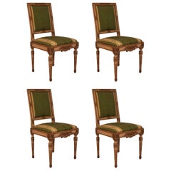 Four French Louis XVI Cream Painted and Gilt Side Chairs, circa 1780