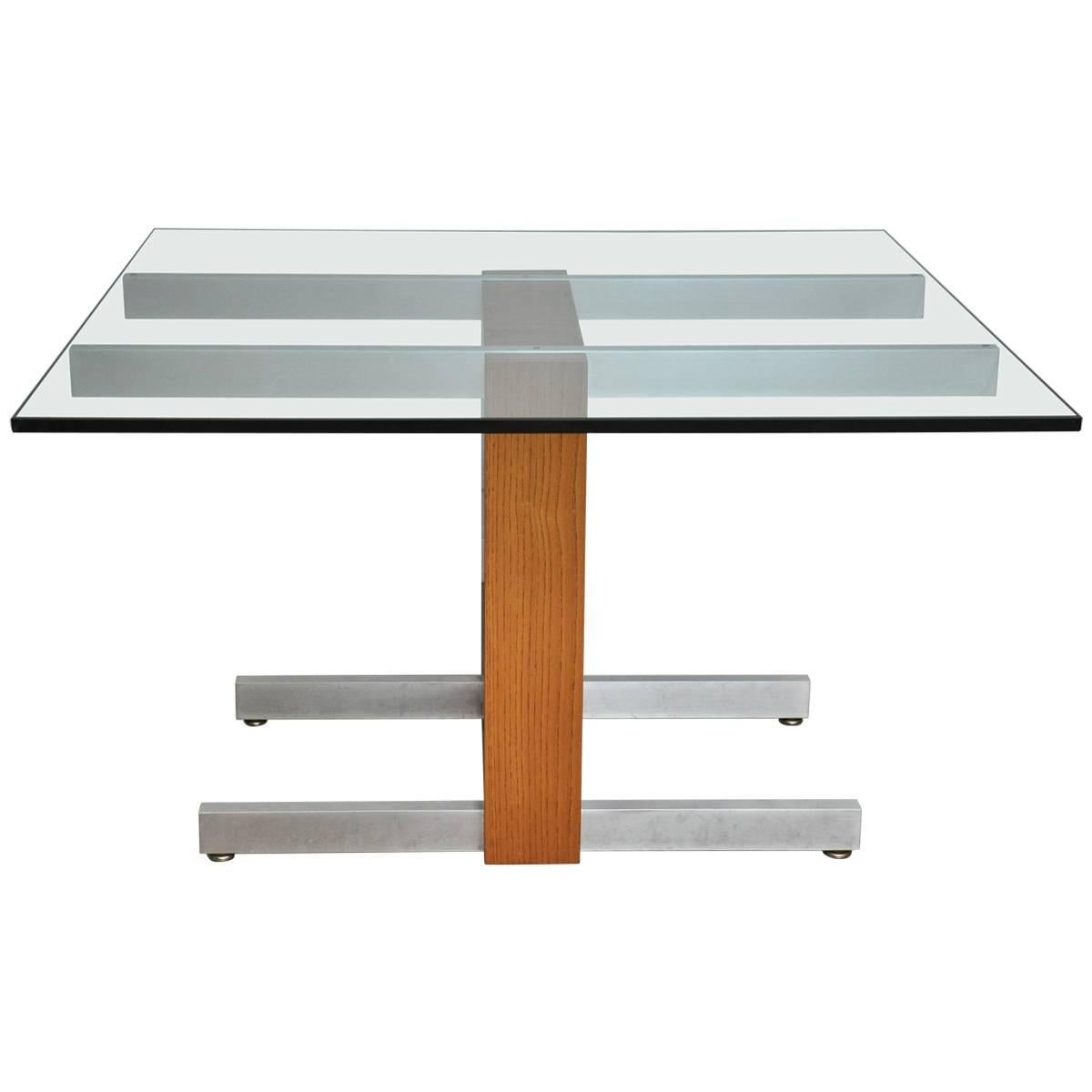 We are proud to offer this vintage 1970 Cubist dining table. Aluminum legs, and stretcher, plate glass top (3/4"), with rare oakwood frame and l2 24" leaves. Excellent original condition, with Kagan label. Also great to be used a s a desk.