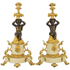 Pair of French Putti Ormolu Patinated Bronze and White Marble Candlesticks