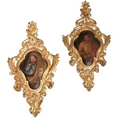 Pair of Continental Baroque Style Painted Giltwood Panels Depicting Saints