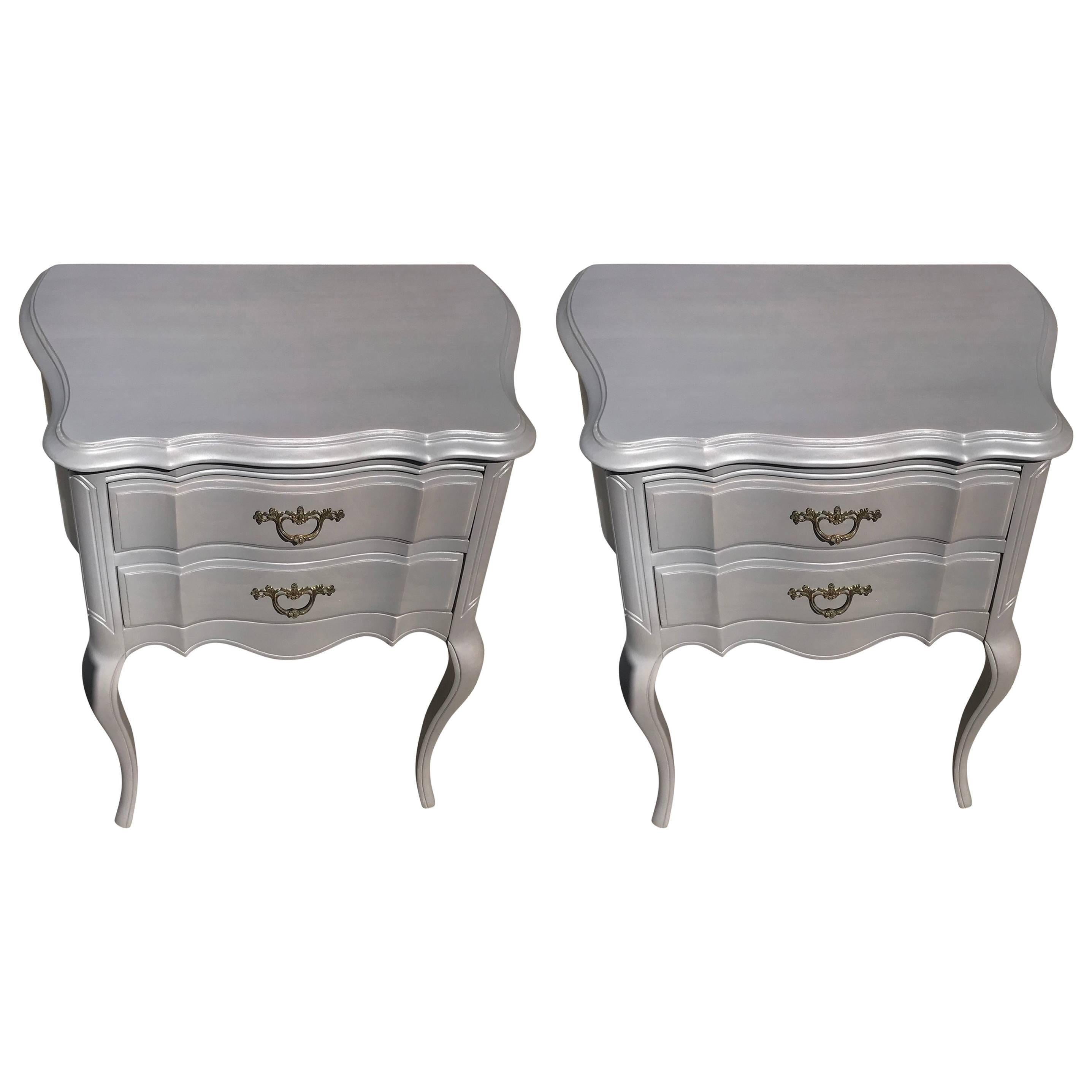 Pair of Hollywood Regency grey stained french style two drawer nightstands. American circa 1950s excellent quality. Refinished in a french grey stain. Wonderful in person.