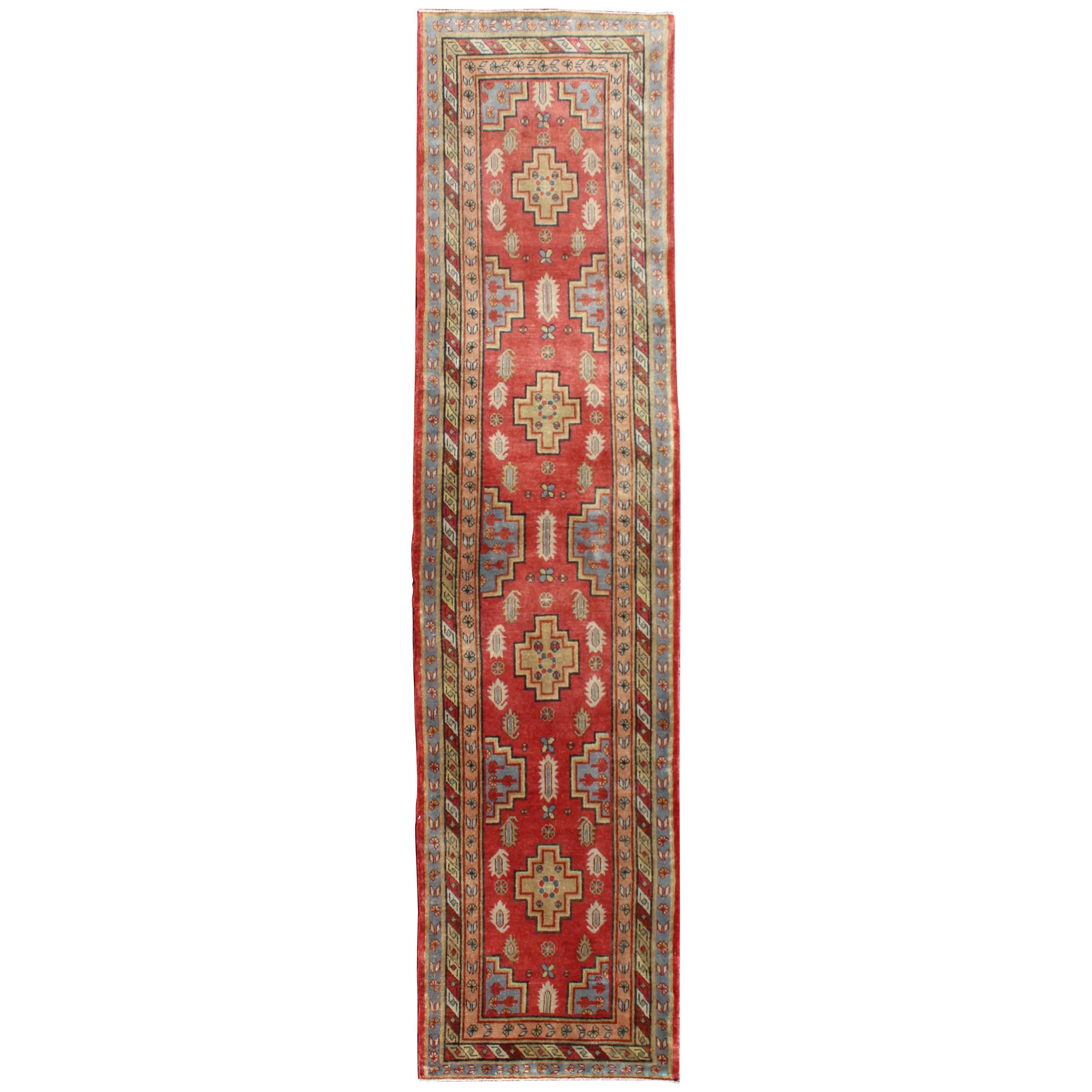 Antique Khotan Runner from Turkestan with Geometric Medallions in Red Background For Sale