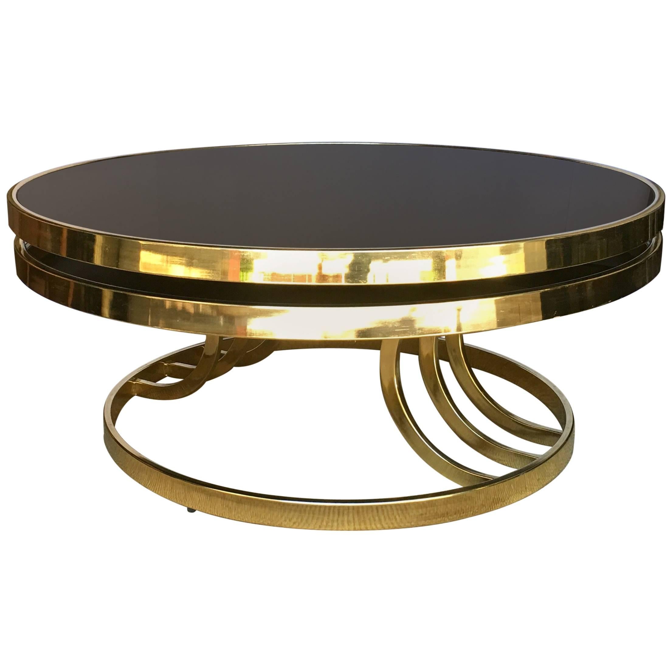 Design Institute America Round Two-Tier Swivel Brass and Glass Cocktail Table