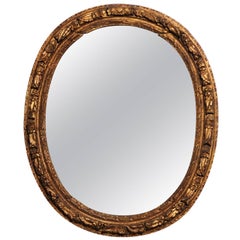 French Louis XIV Period 1710s Giltwood Oval Mirror with Carved Rosettes