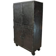 Exceptional Four-Doors Industrial Riveted Iron Cabinet on Wheels, circa 1900 Exceptional Four-Doors Industrial Riveted Iron Cabinet on Wheels, circa 1900