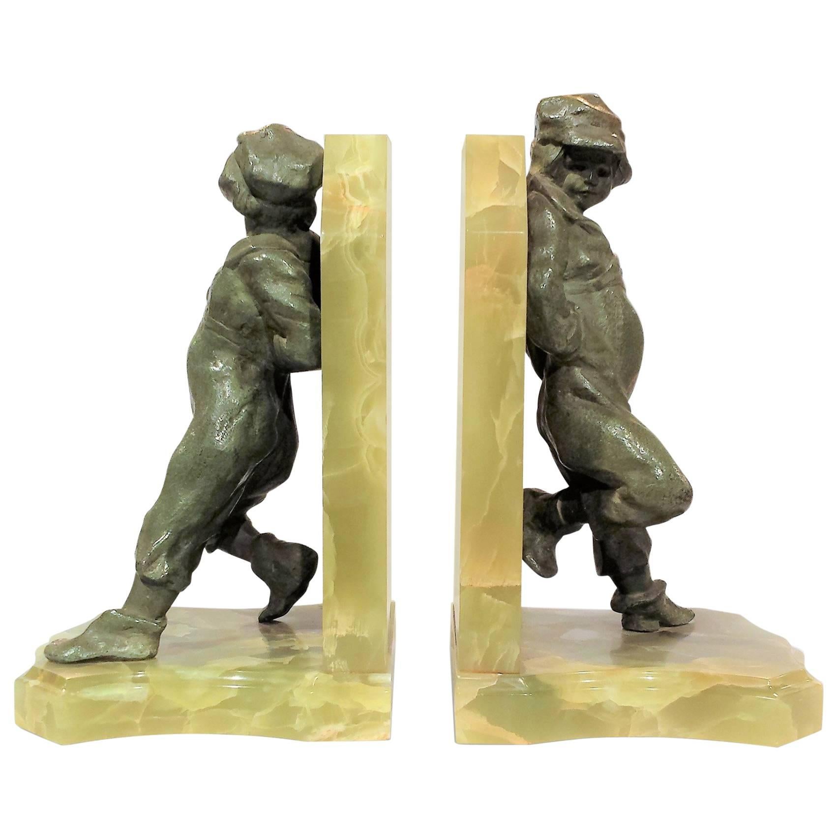 'Young Lads', Pair of Art Deco Bookends in Bronze and Onyx by Henri Molins