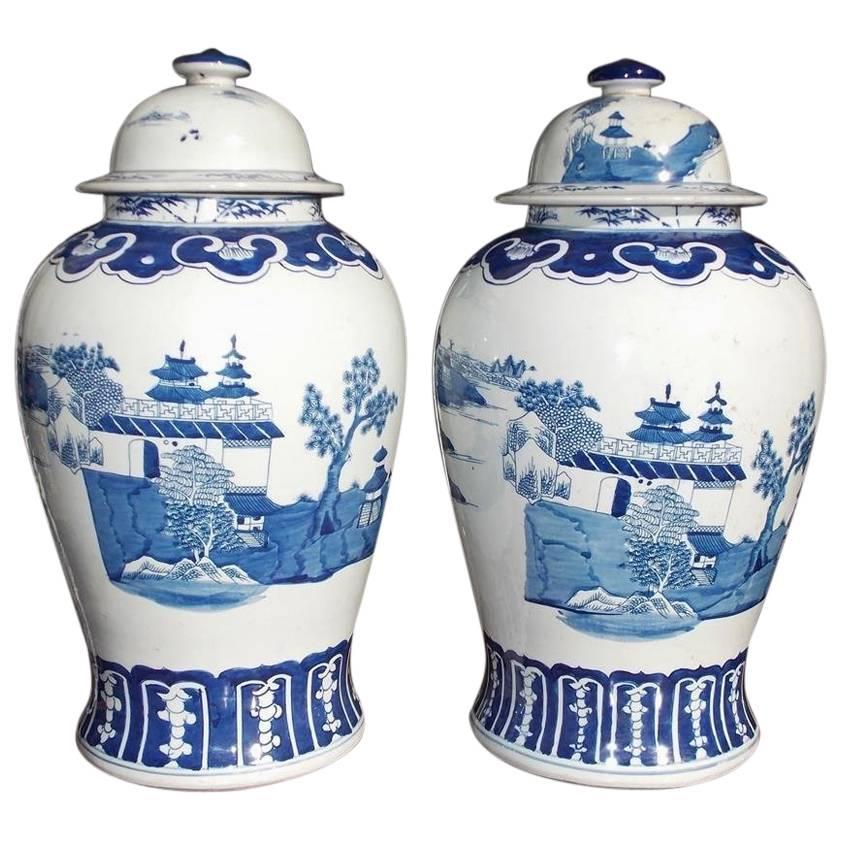 Pair of Chinese Porcelain Glazed Blue & White Temple Jars with Lids, 20th Cent.