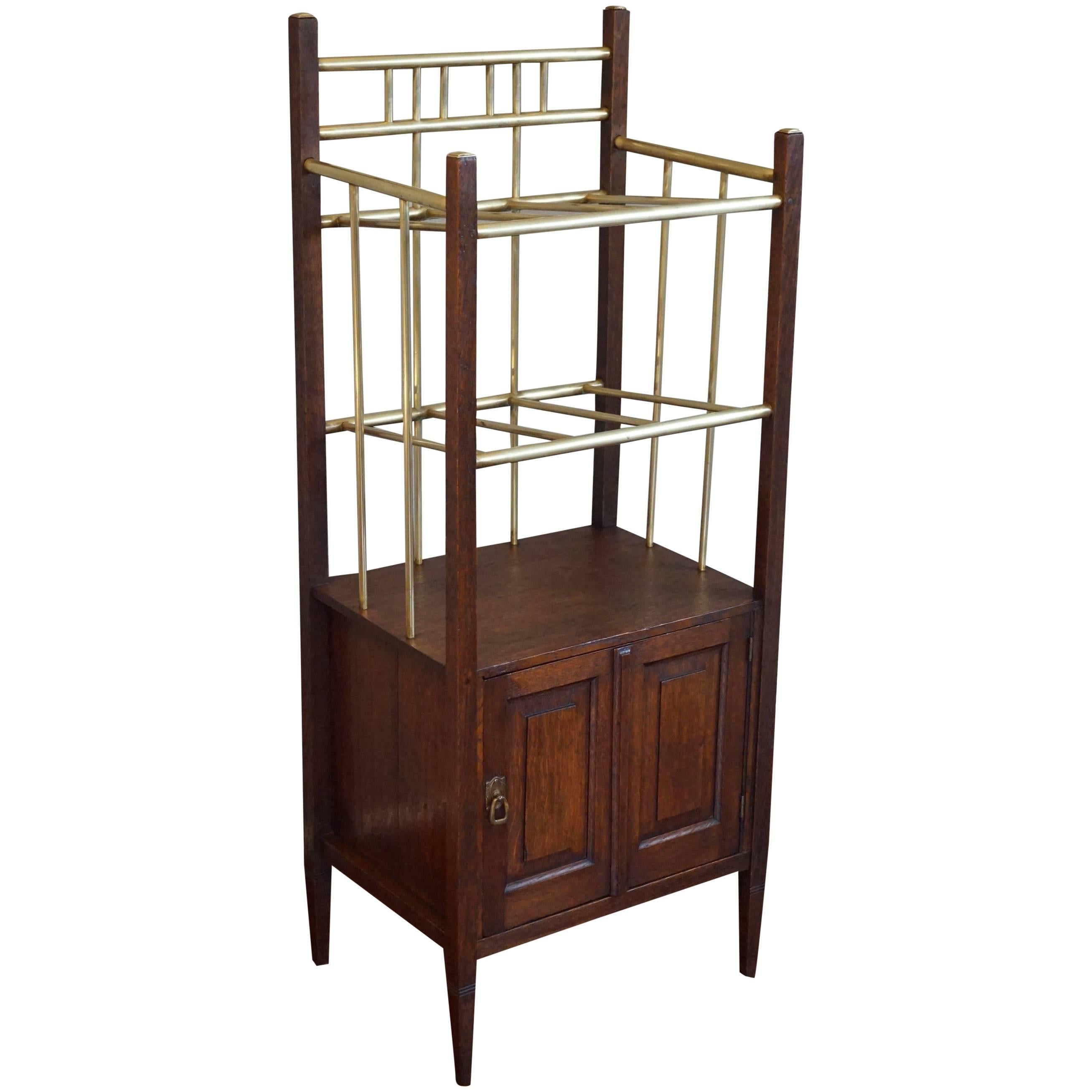 Arts & Crafts Oak and Polished Brass Magazine Stand with Cabinet from circa 1900 For Sale