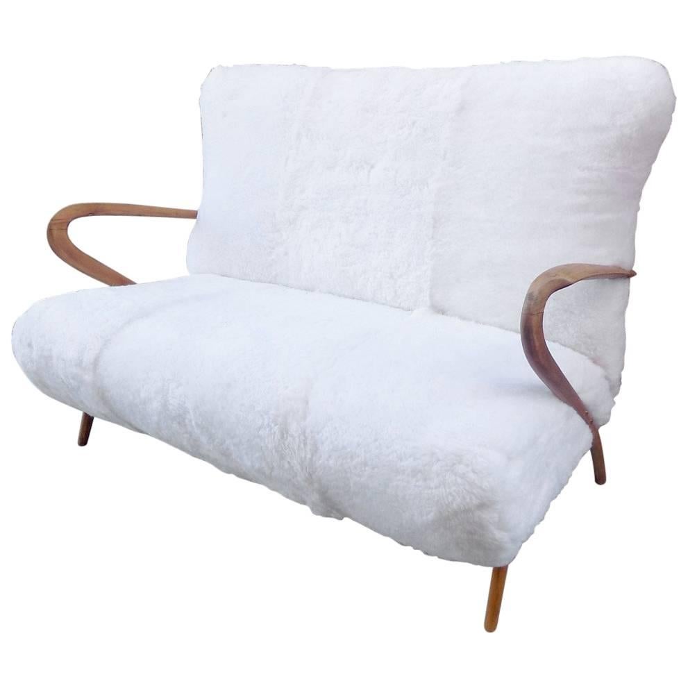 Beautiful Italian sofa by Gugliermo Ulrich, reupholstered in a Sheep Fur For Sale