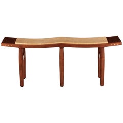 American Studio Sculpted Walnut and Cherry Saddle Bench, circa 2001