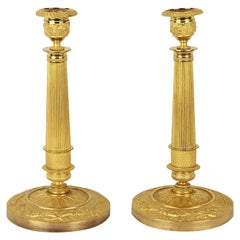 Paire de chandeliers Empire en bronze doré