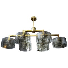 Lustre en laiton Glustin Luminaires Creation avec cylindre en verre gris