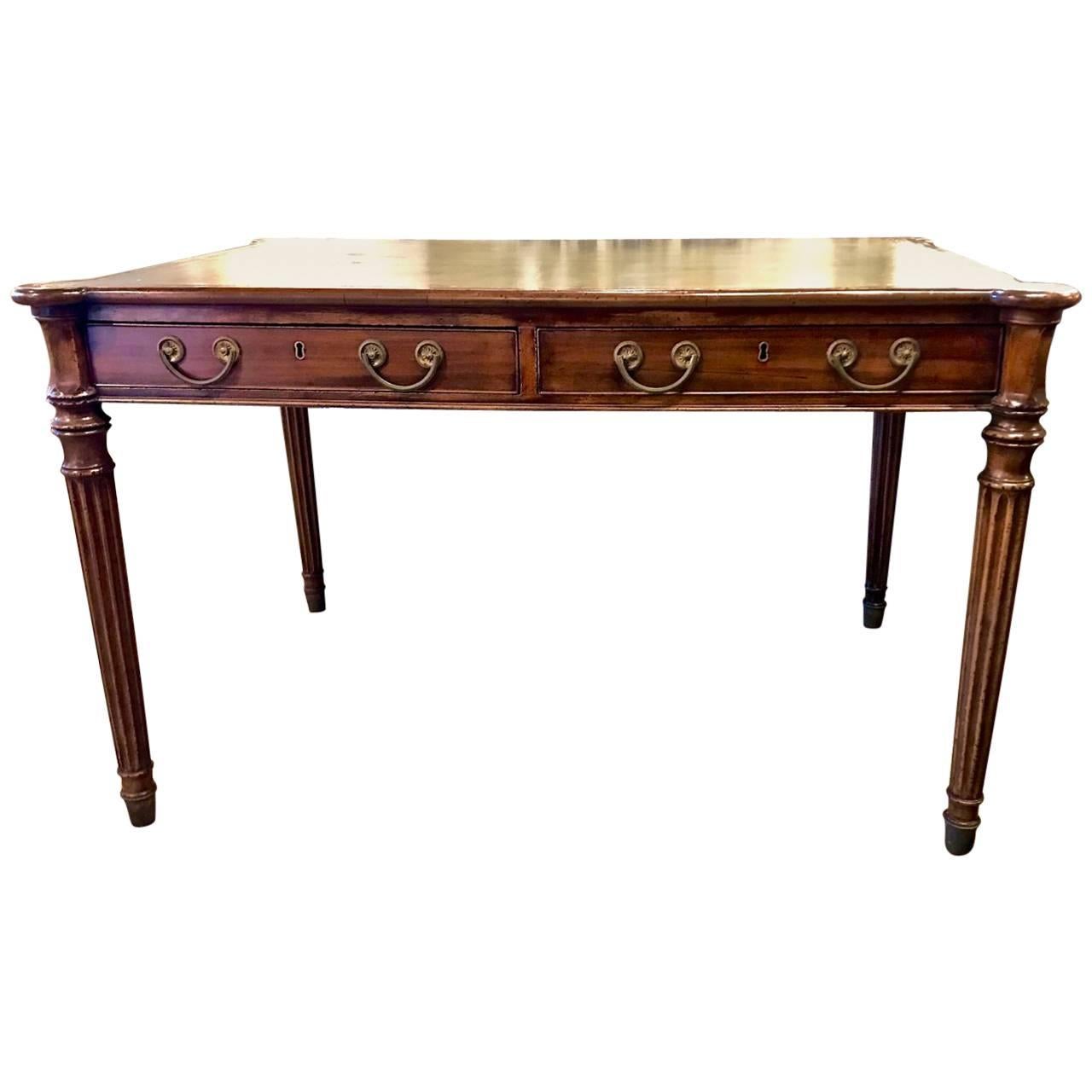 This is a very high quality English Mahogany Partners Writing Table. The table dates to circa 1810-20 and is detailed with functional drawers to both sides of table, outset hexagonal corners, solid mahogany and oak construction, magnificent all