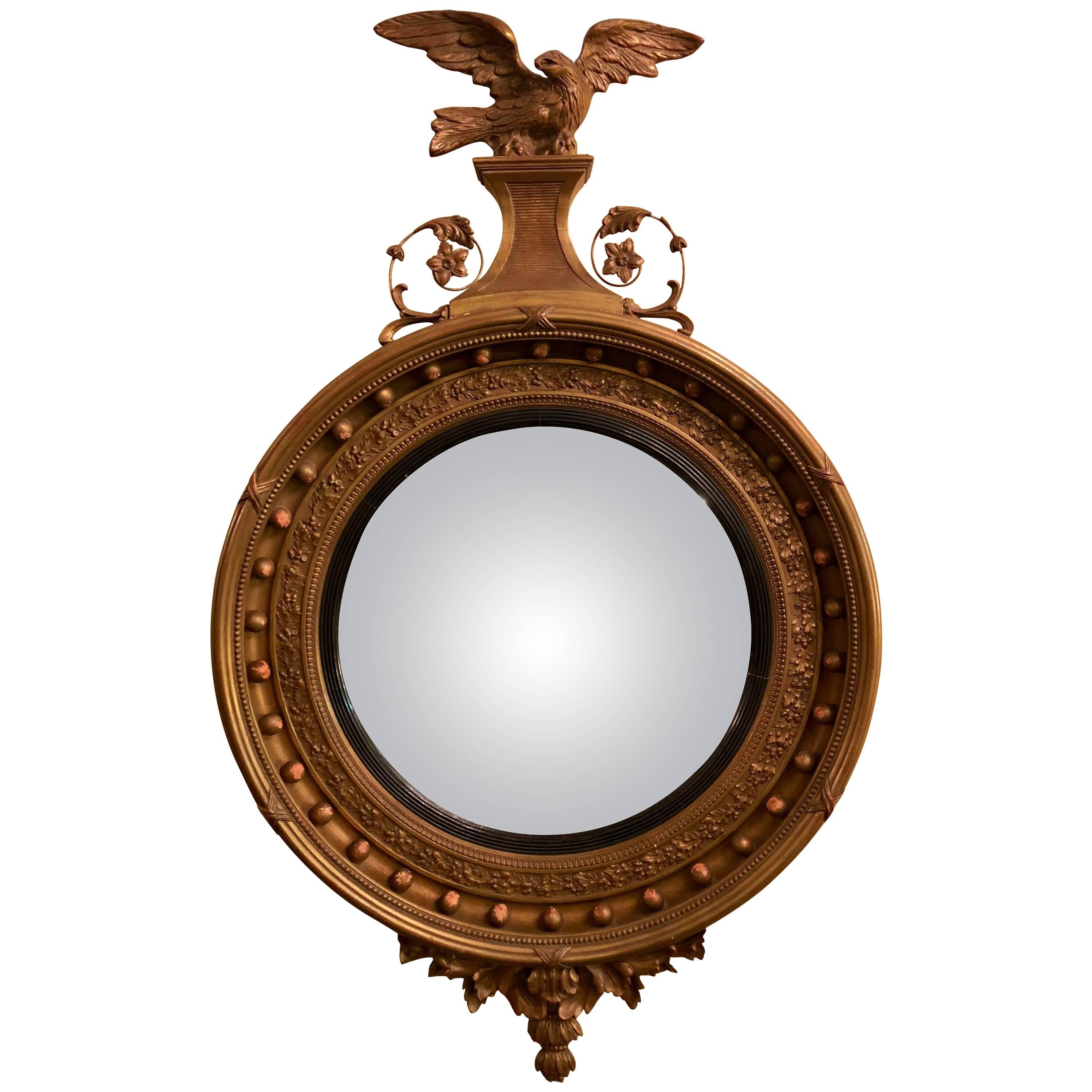Federal Style Gilt Gold Convex Mirror Adorning a Carved Eagle