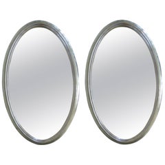 Pair of Mid-Century Oval Silver Mirrors