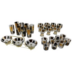 Vintage Extensive Set of 22-Karat Gold and Black Coin Barware and Glasses by Cera MCM