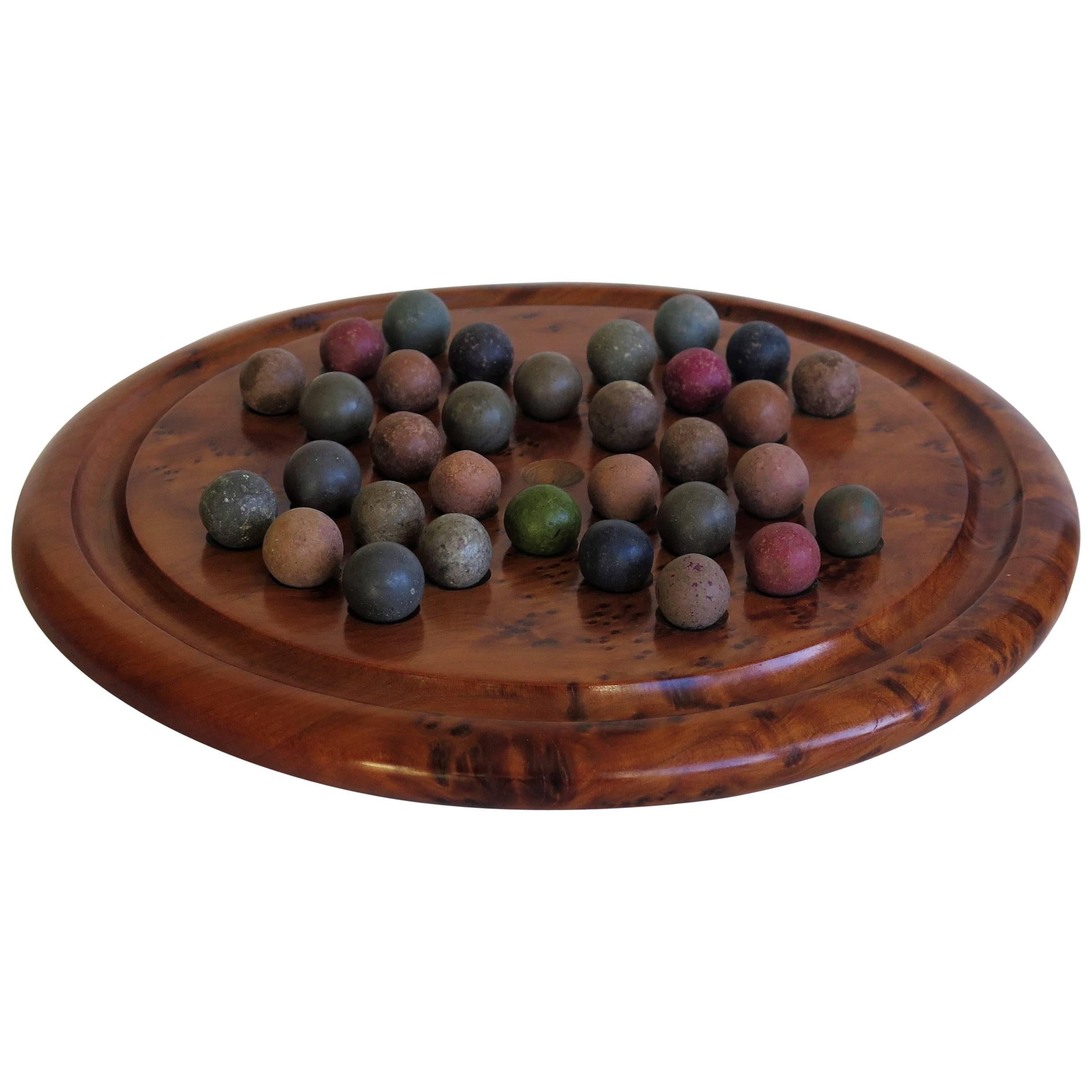Marble Solitaire Board Game with 32 Early Handmade Stone Marbles, Ca 1900
