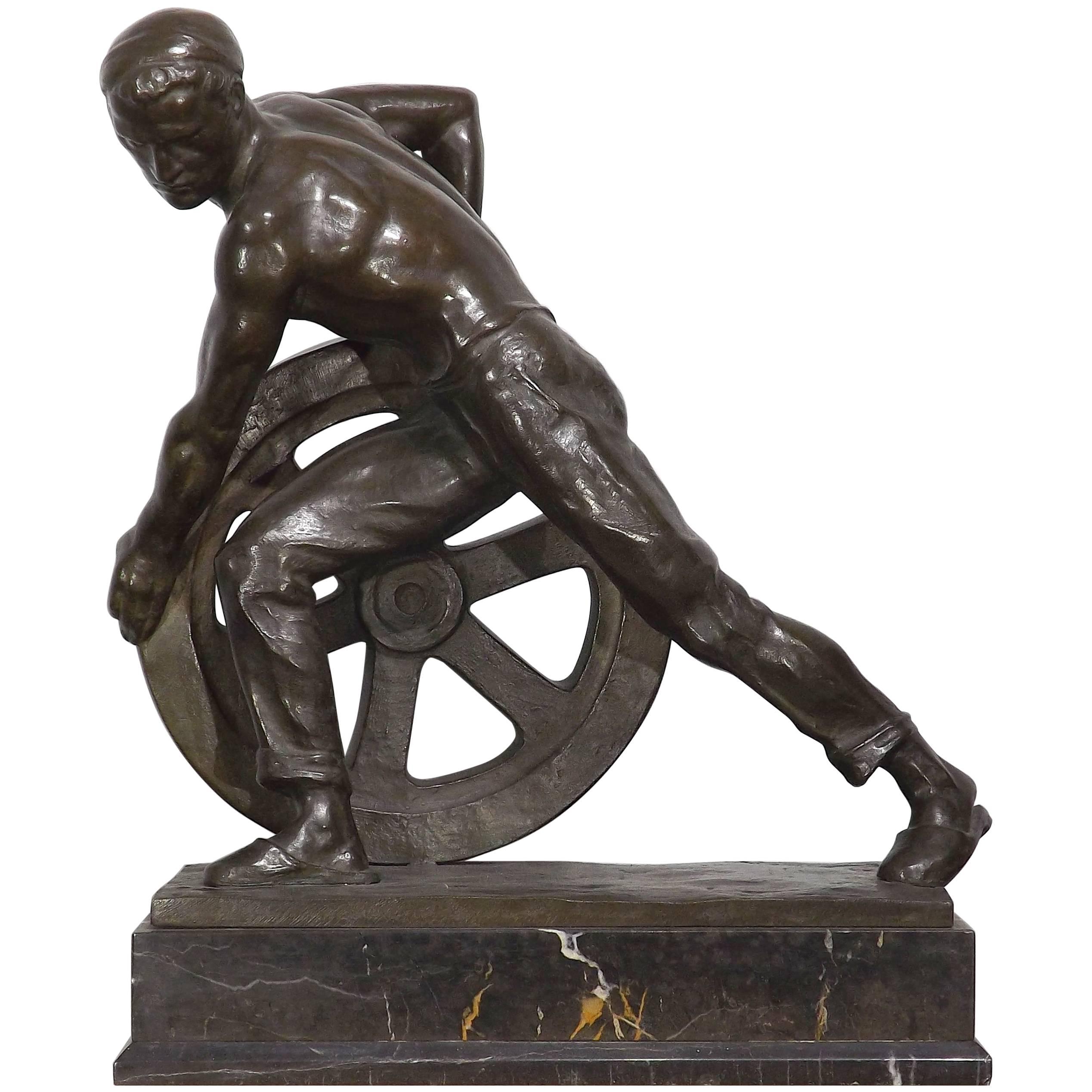 Bronze of a Man Pushing a Wheel by Ernst Seger For Sale