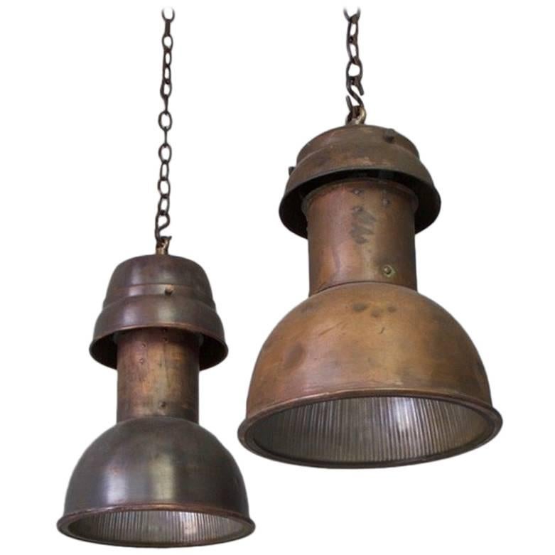 Two Similar Copper Pendant Lights with Faceted Glass Interiors