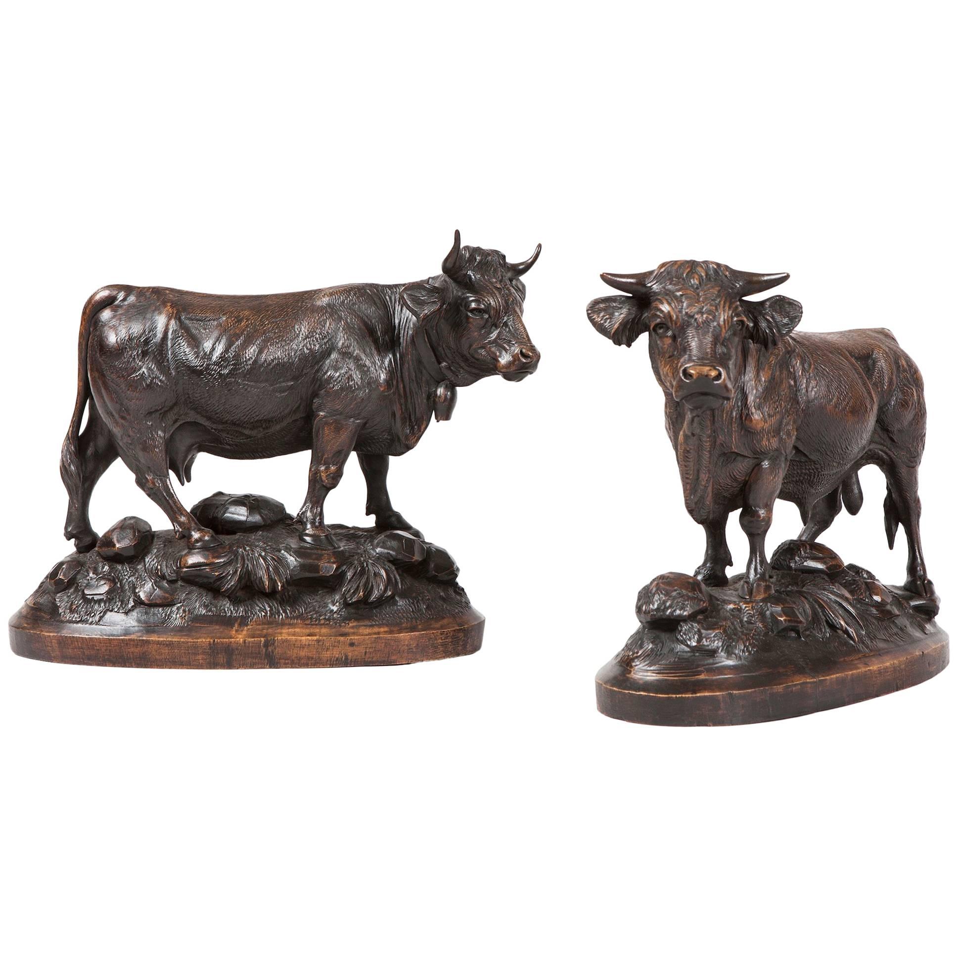 Pair of Swiss 19th Century Carved Wooden Cattle For Sale