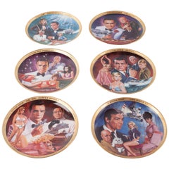 Franklin Mint Edition limitée de six assiettes James Bond par Dick Bobnick