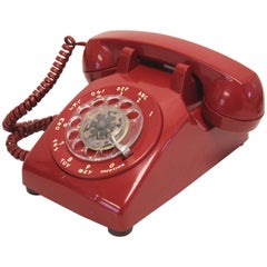 Téléphone de bureau Western Electric rouge moderne du milieu du siècle dernier:: 1970
