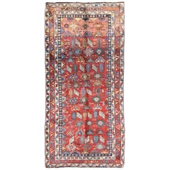 Tapis persan Qashqai ancien avec motif sous-géométrique sur toute sa surface et bordure à étages