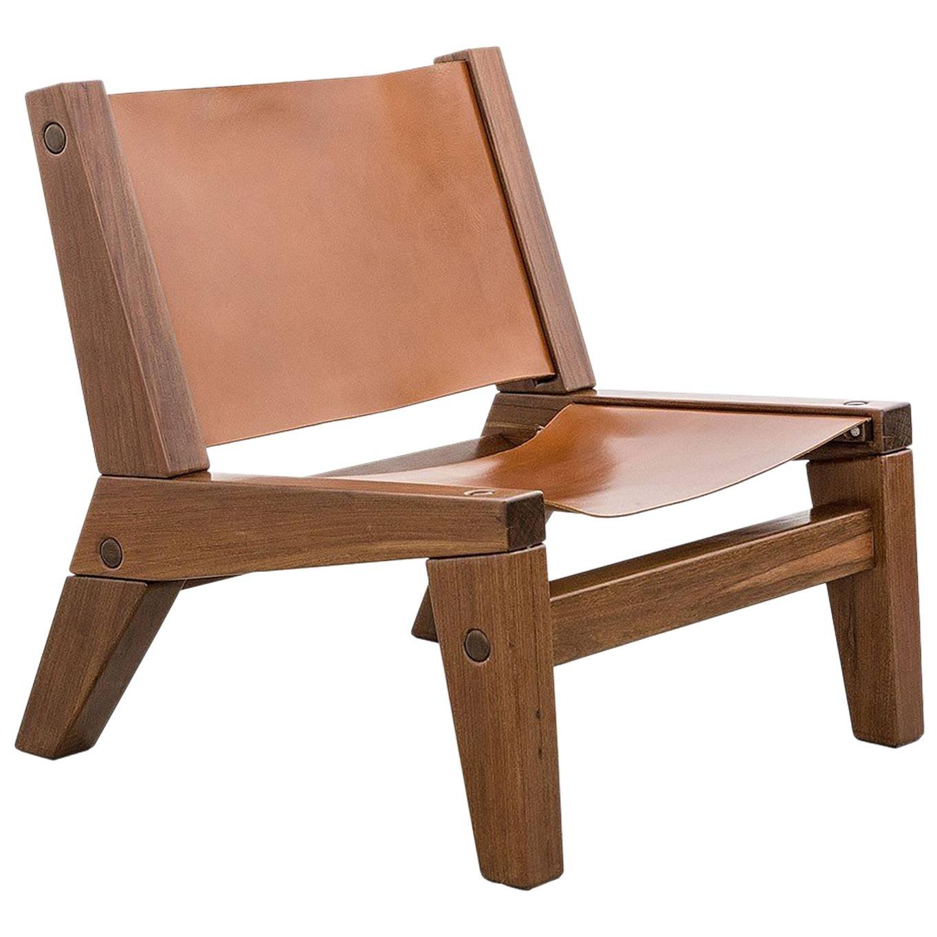 The PC line of Brazilian contemporary pieces, which this casual lounge chair is part of, was created exclusively by Zanini de Zanine for Herança cultural. The piece is constructed with Brazilian Ipê solid wood extracted from demolition.