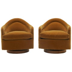 Pair of Tilt and Swivel Barrel Chairs by Milo Baughman.  Caramel color Mohair.
