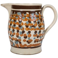 Ancienne cruche en poterie Mochaware décorée d'engobe
