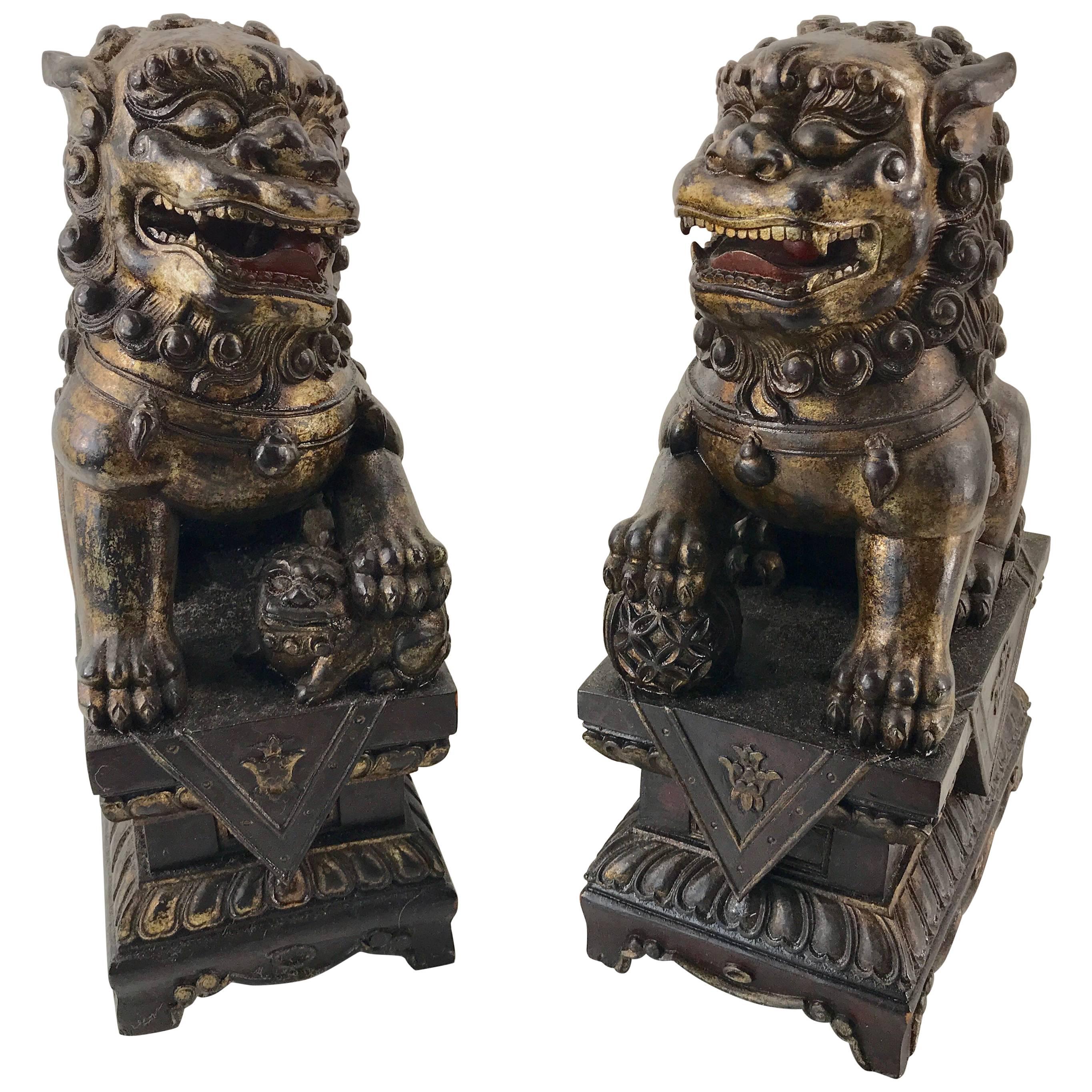 Pair of Chinese Carved Wood and Giltwood Foo Dogs