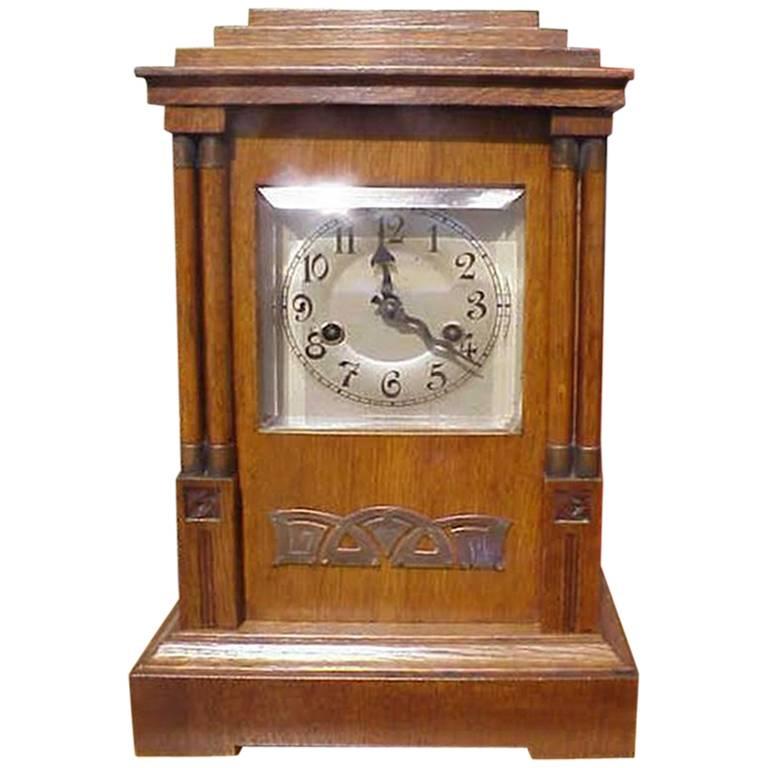 A Continental Arts and Crafts Oak Mantle Clock with Carved Stylised Glasgow Roses For Sale at