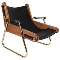 GRAPPA Contemporary Leather Lounge Chair with Walnut Panels and Brass Piping