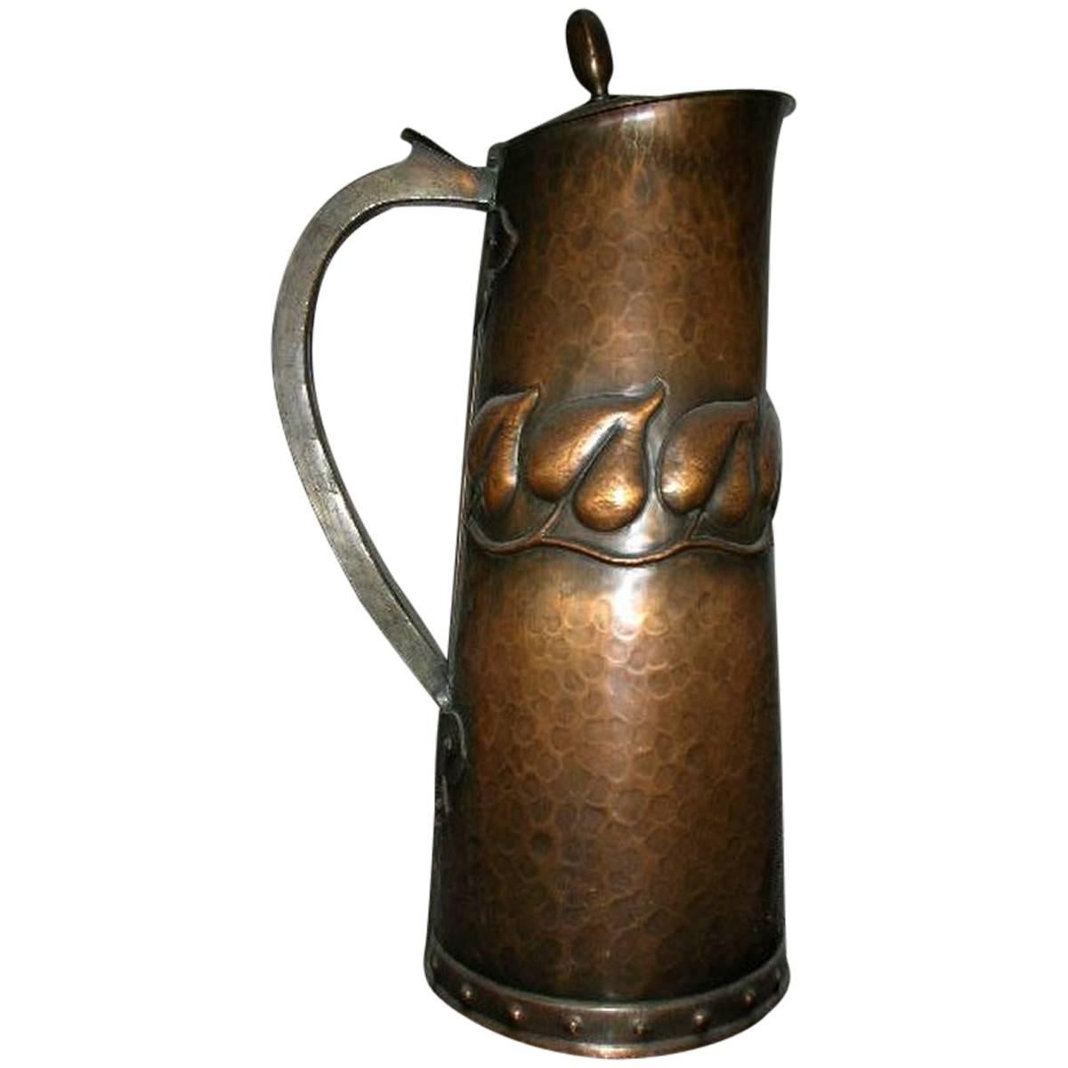 Arts & Crafts Copper Jug with Stylised Repousse Leaf Details