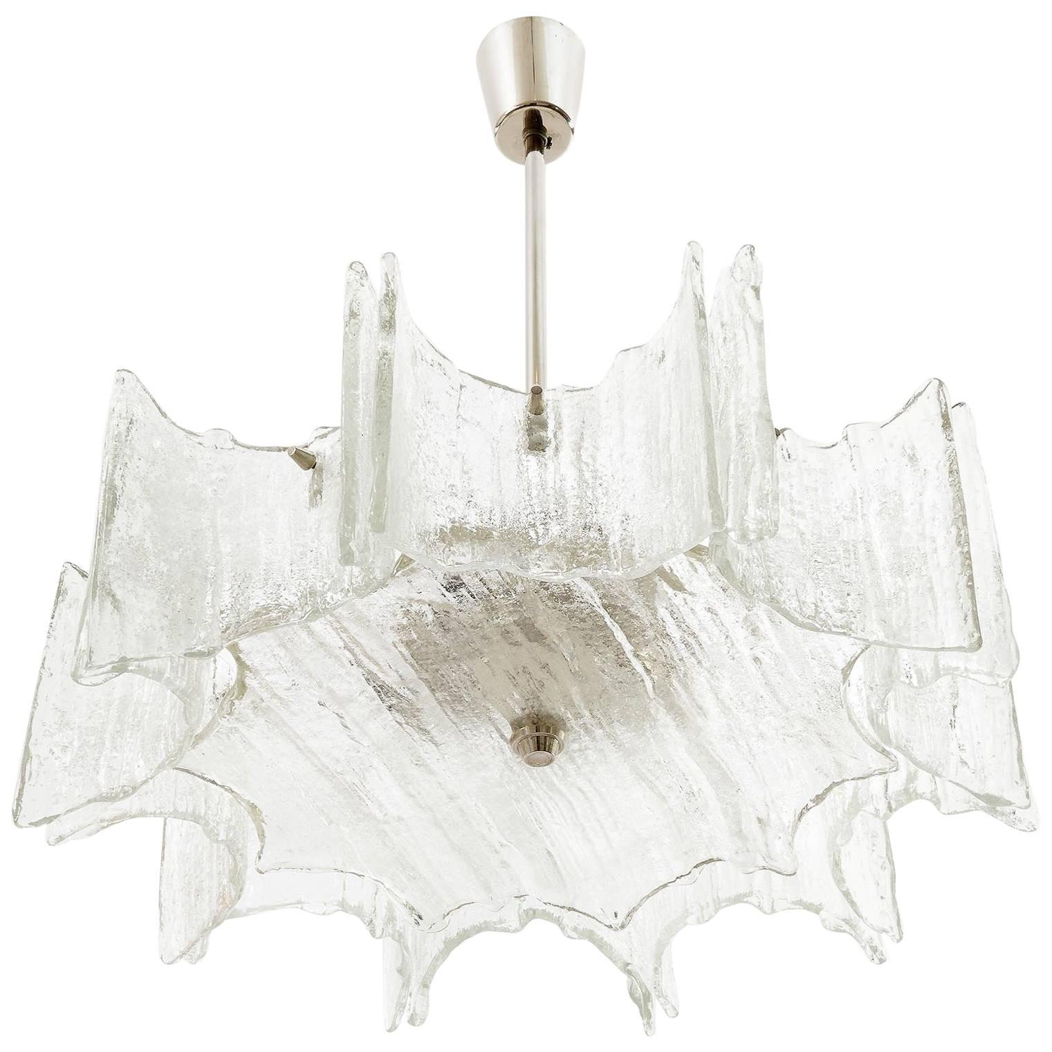 A star-shaped ceiling light by Kalmar manufactured in Austria in Mid-Century, circa 1970 (late 1960s or early 1970s). 
It can be used as chandelier or as flush mount light. We can provide a flush mounting fixture for free. 
The lamp is made of